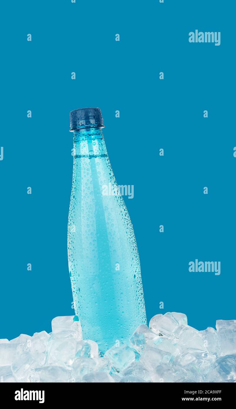 frozen water bottle for hiking partially thawed. bottle shape keeps ice  from floating Stock Photo - Alamy