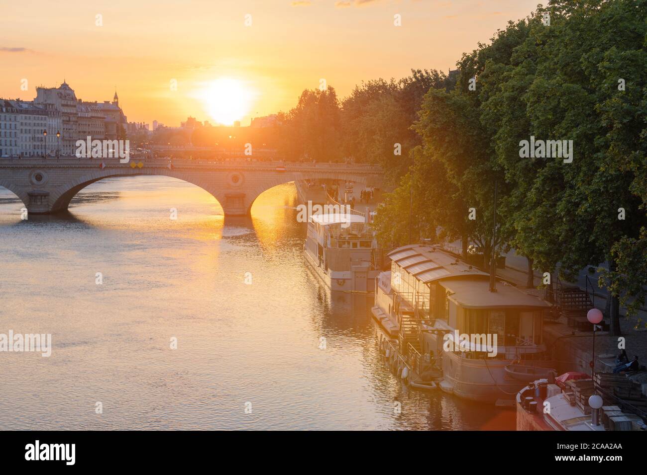 PARIS, FRANCE -Sunset over the seine river. Paris is one of the most popular tourist destinations in Europe. Stock Photo