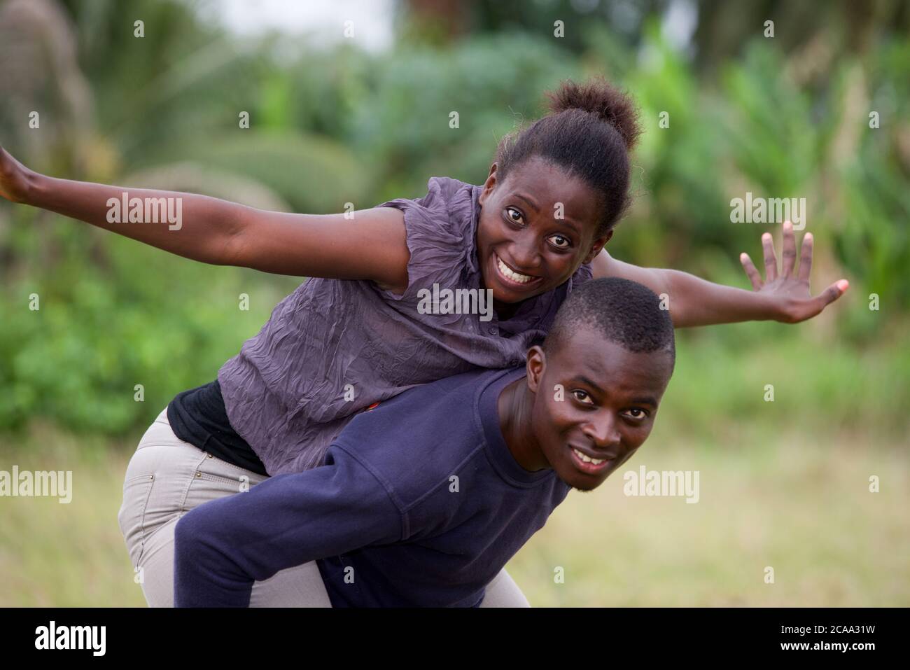 Back view young man putting hi-res stock photography and images - Alamy