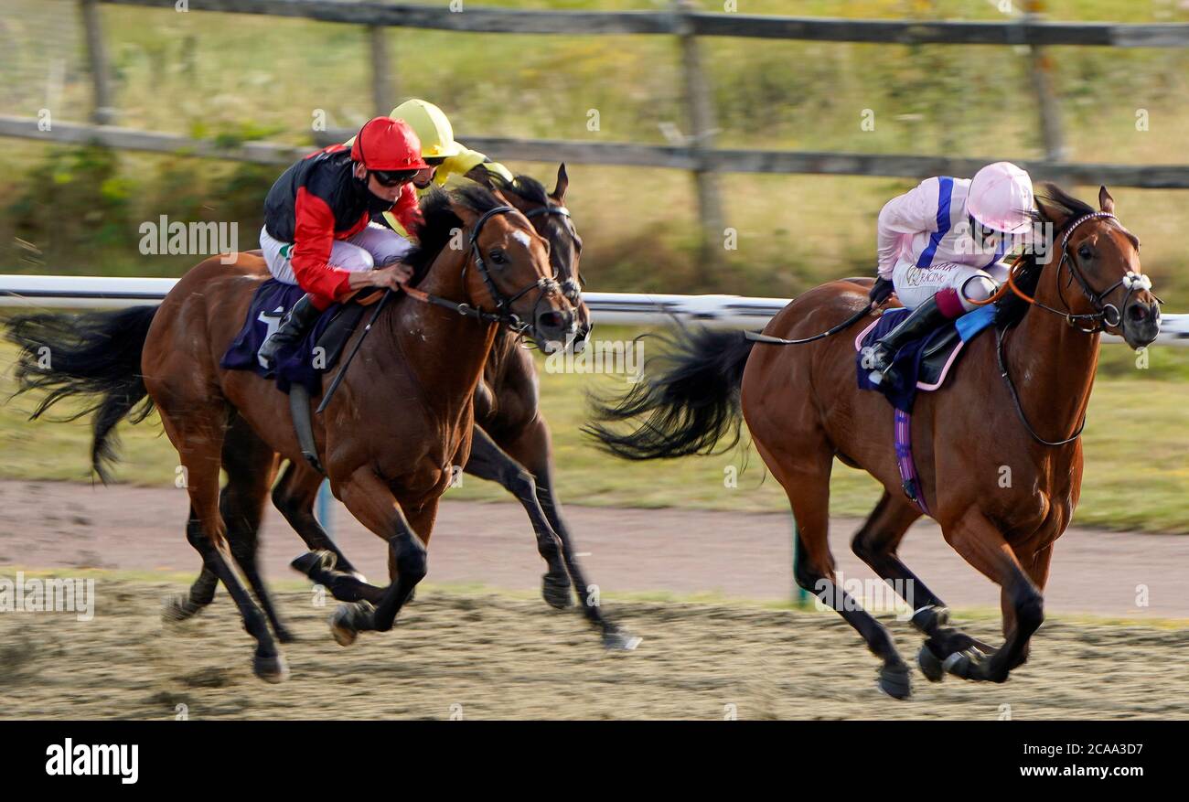 Oisin Murphy riding Summit Fever (right) winning The Betway Maiden Stakes at Lingfield Park on August 05, 2020 in Lingfield, England. Owners are allowed to attend if they have a runner at the meeting otherwise racing remains behind closed doors to the public due to the Coronavirus pandemic. (Photo by Alan Crowhurst/Getty Images) at Lingfield Park Racecourse, Surrey. Stock Photo
