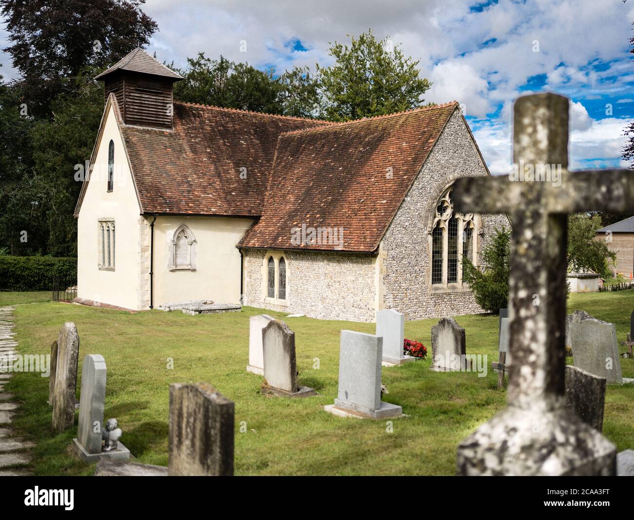 The churchyard and graveyard of St Simon and St Jude church in Bramdean Hampshire UK Stock Photo