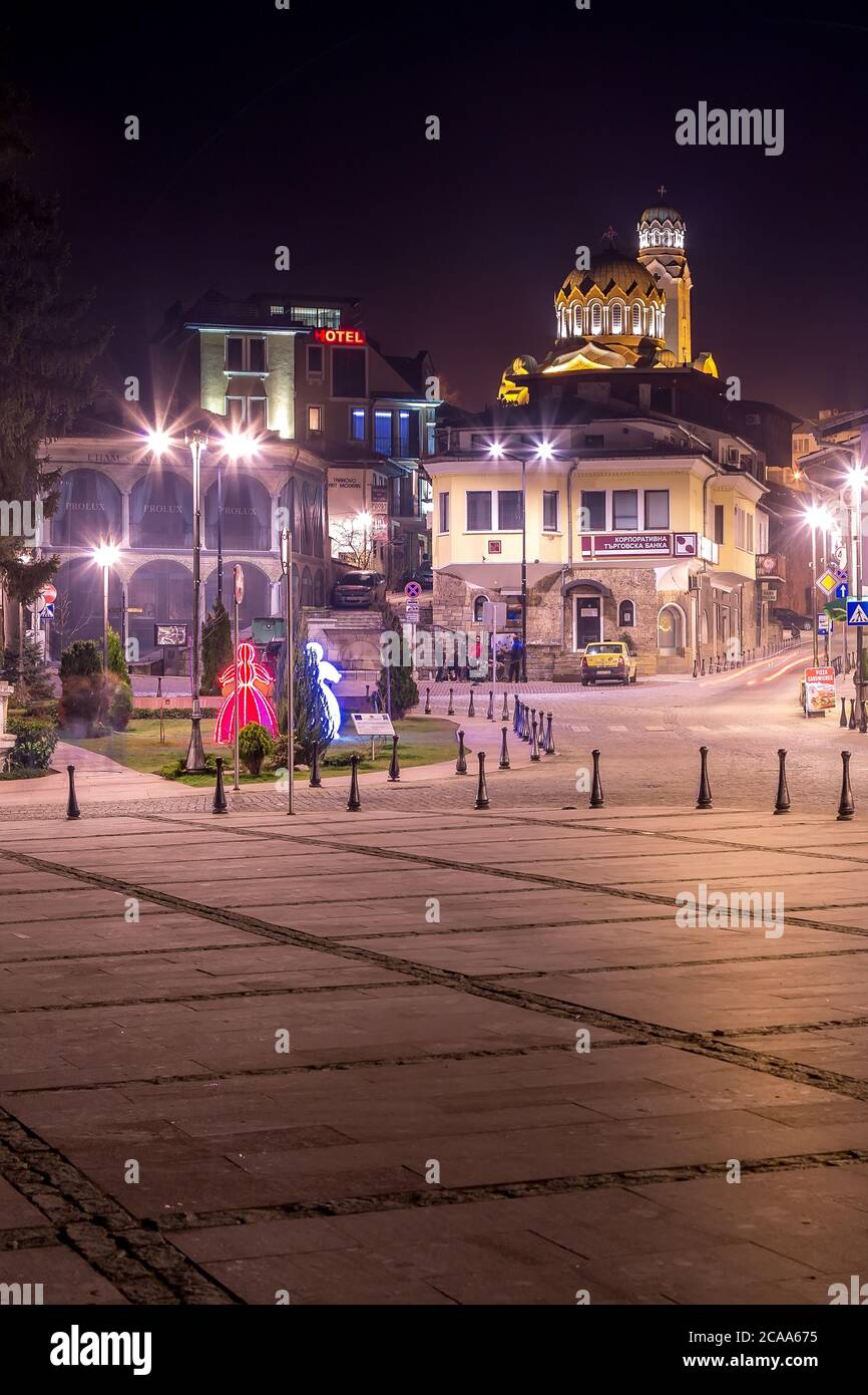 Veliko Tarnovo, Bulgaria - March, 23, 2015: Night view of cathedral, martenitsa figurines and square in Veliko Tyrnovo Stock Photo