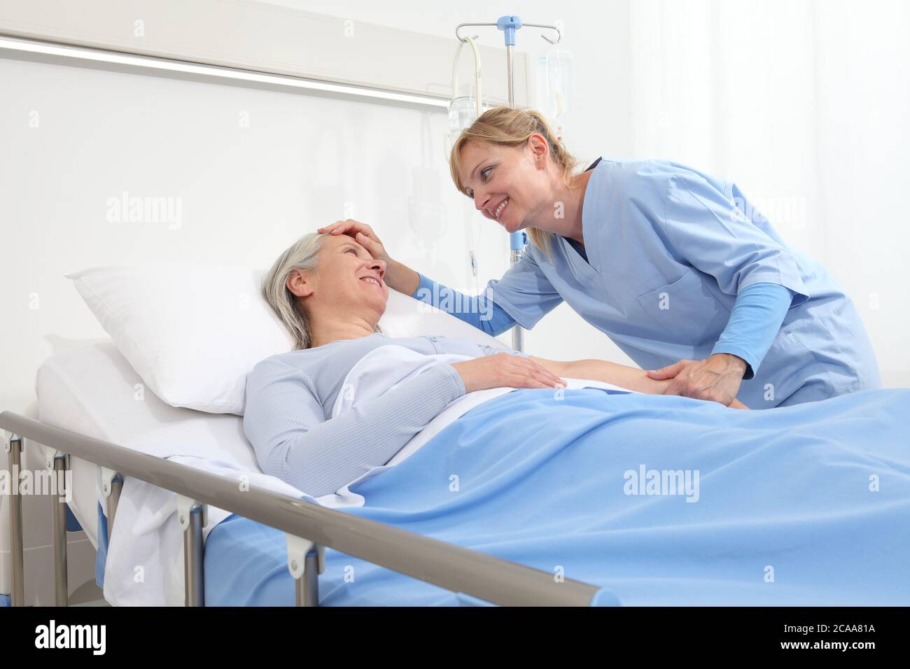 Old woman hospital bed nurse hires stock photography and images Alamy
