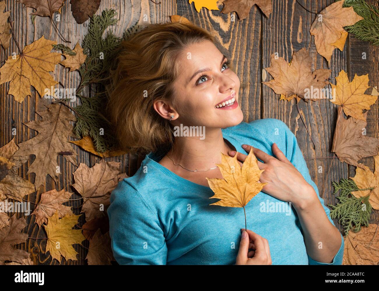 Happy Woman Enjoying Life in the Autumn on the Nature Stock Photo