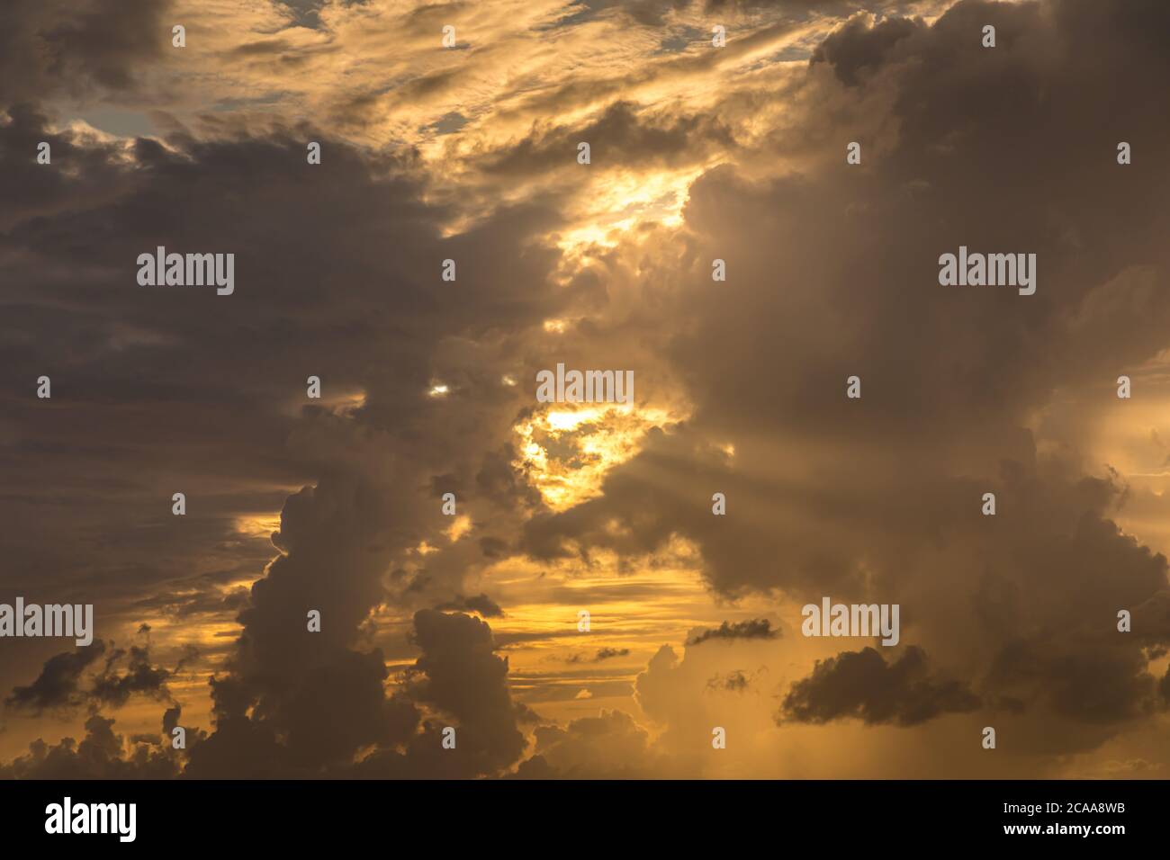 Dramatic clouds in the evening with sun rays Stock Photo