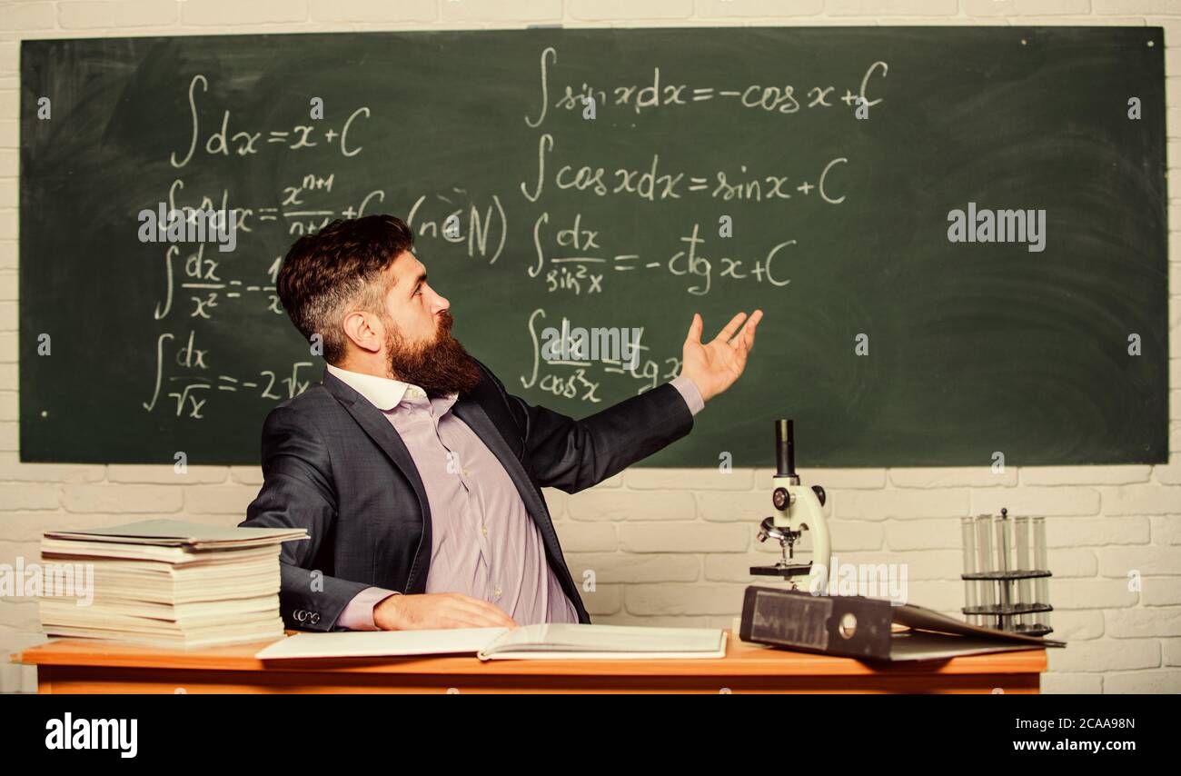 Teaching and education. University teacher use teaching aids. Bearded