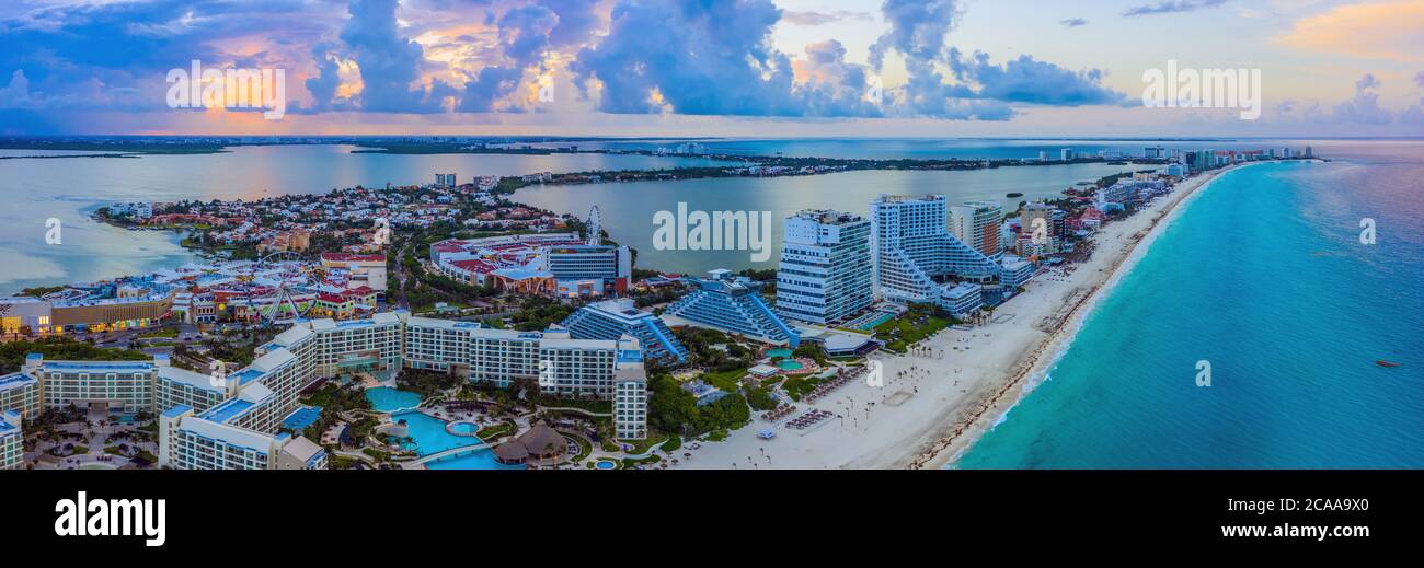 Aerial panoramic view looking north of the Hotel Zone (Zona Hotelera) and the beautiful beaches of Cancún, Mexico at sunset Stock Photo