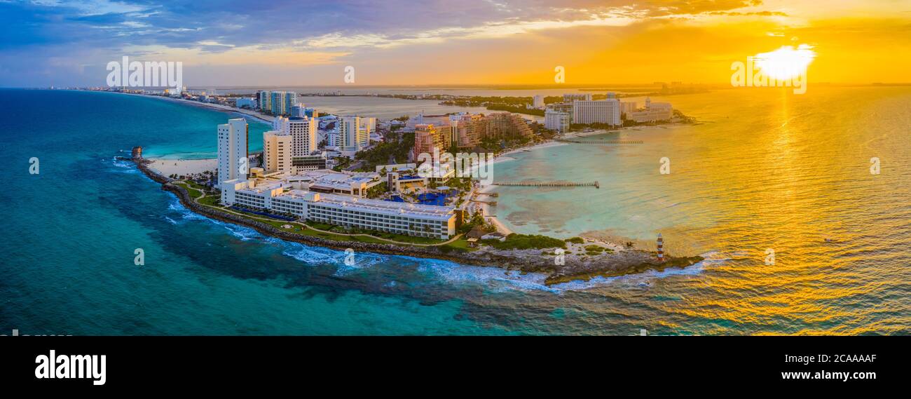 Aerial panoramic view of the northern peninsula of the Hotel Zone (Zona Hotelera) in Cancún, Mexico at sunset Stock Photo