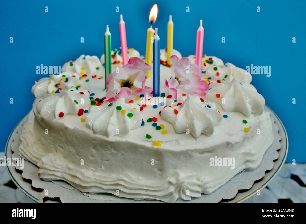 birthday cake with lit candles Stock Photo - Alamy