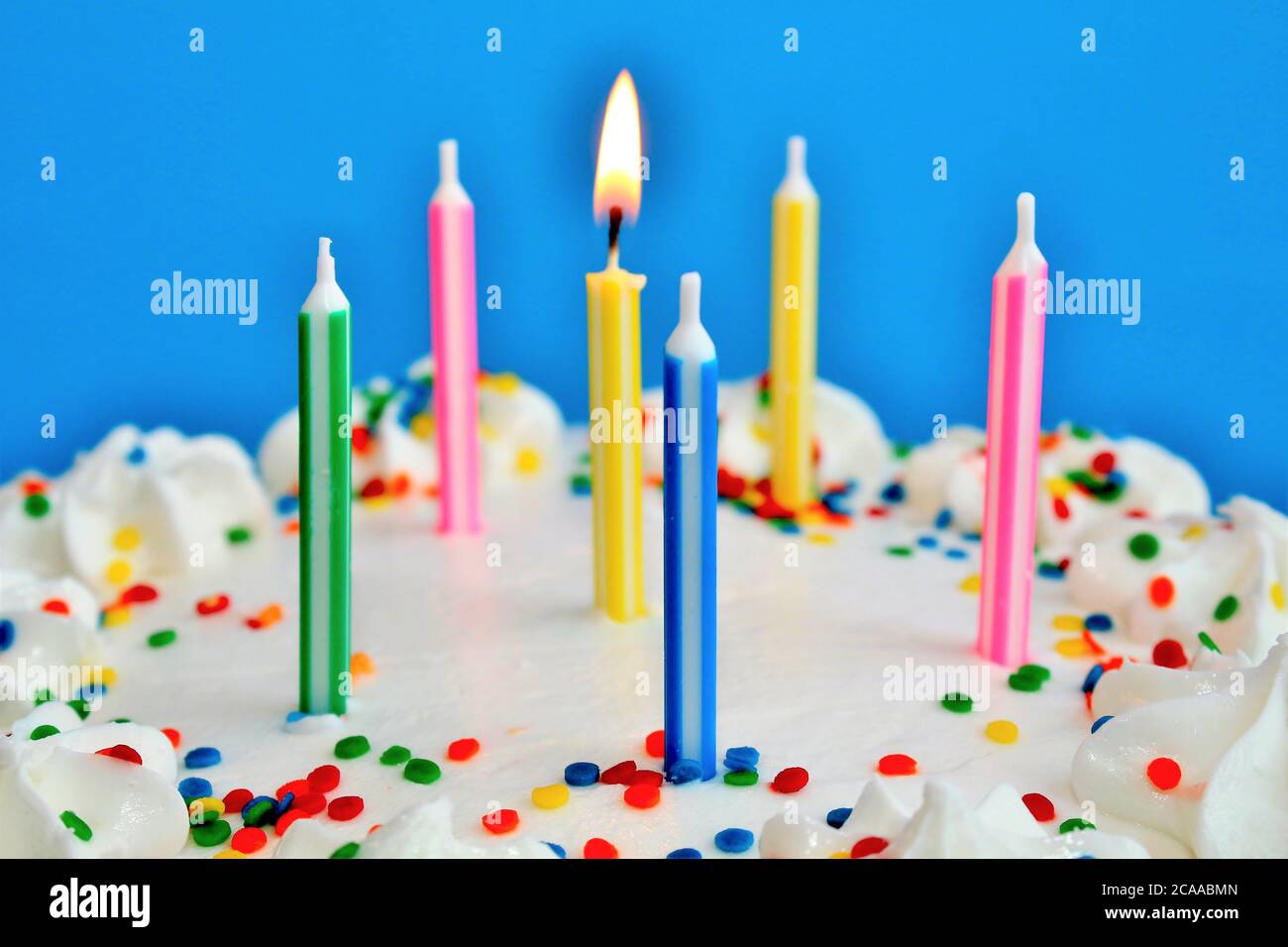 Birthday cake with lit candles Stock Photo Alamy