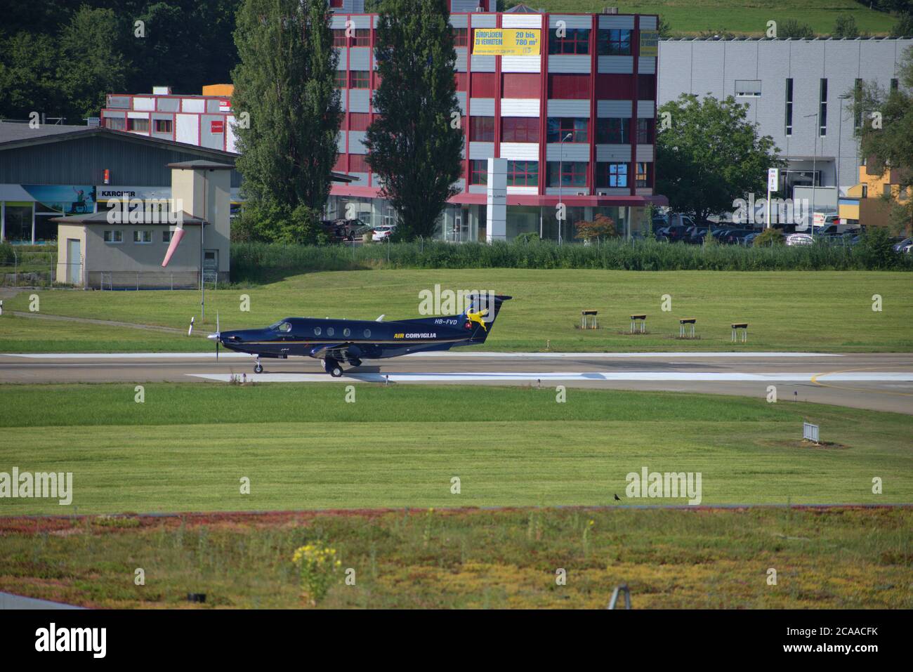 Pilatus PC-12 is taxiing at the airport Saint Gallen Altenrhein in Switzerland Stock Photo