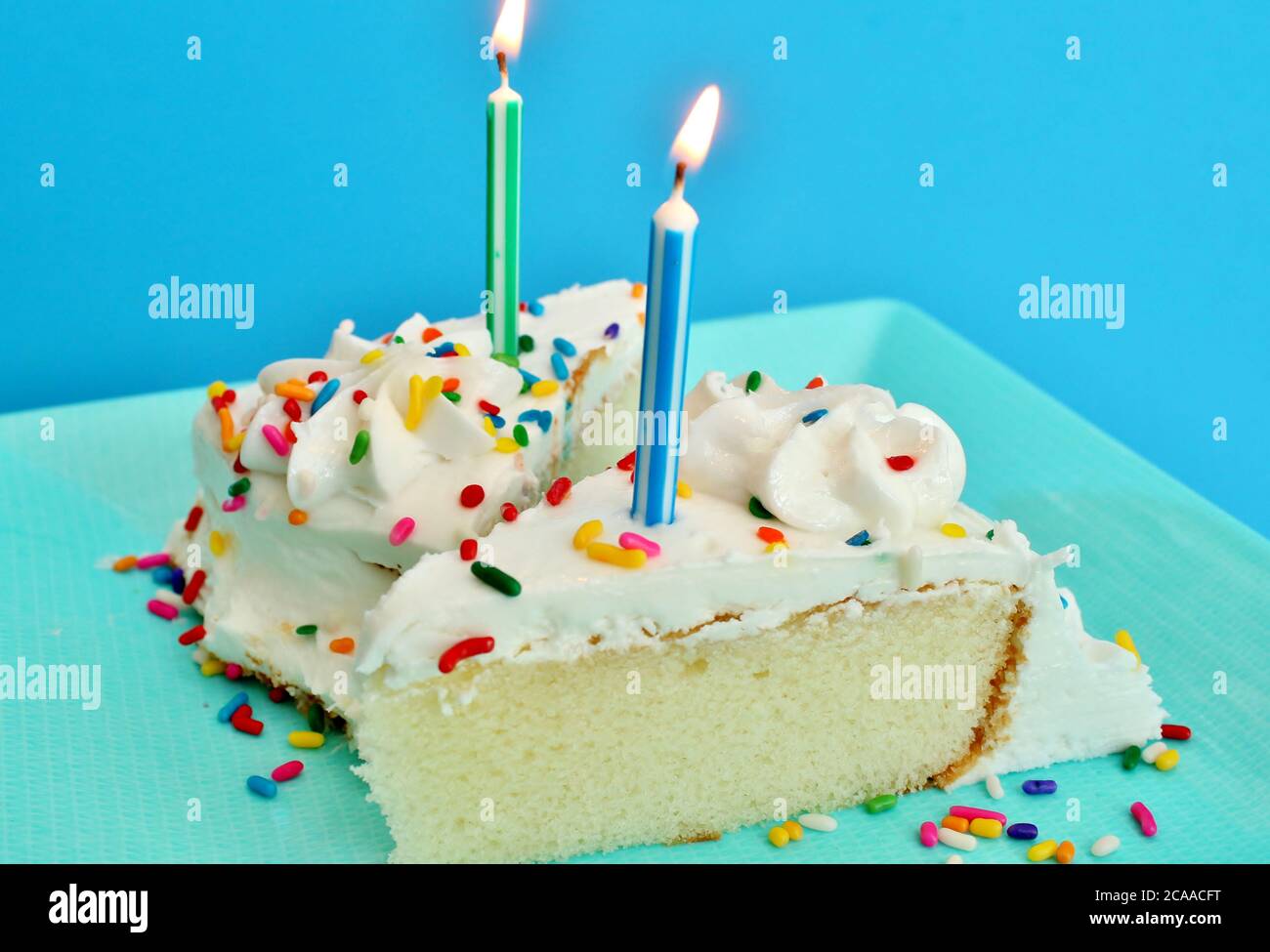 Birthday cake with lit candles Stock Photo - Alamy
