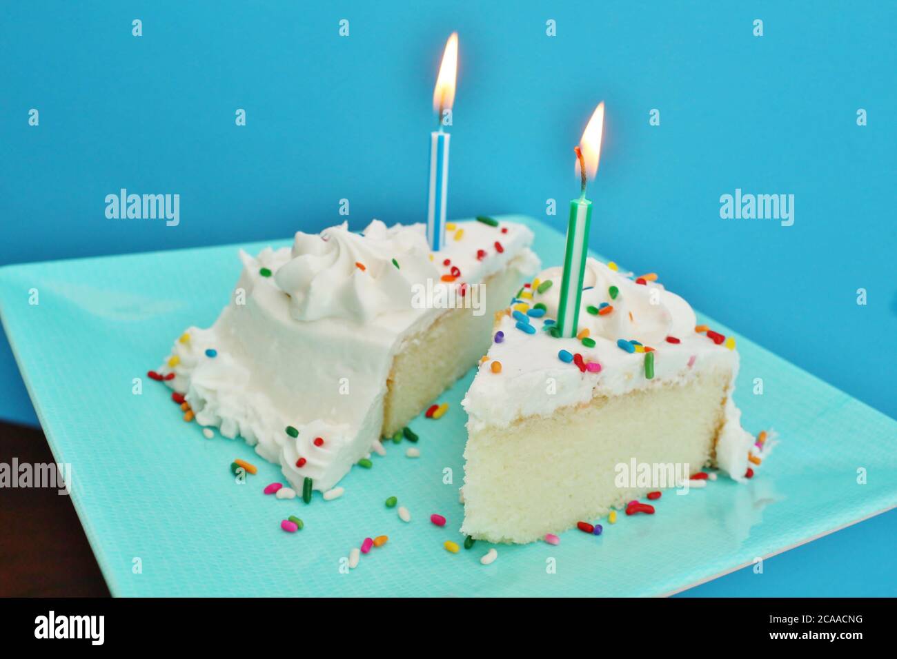 Birthday cake with lit candles Stock Photo Alamy