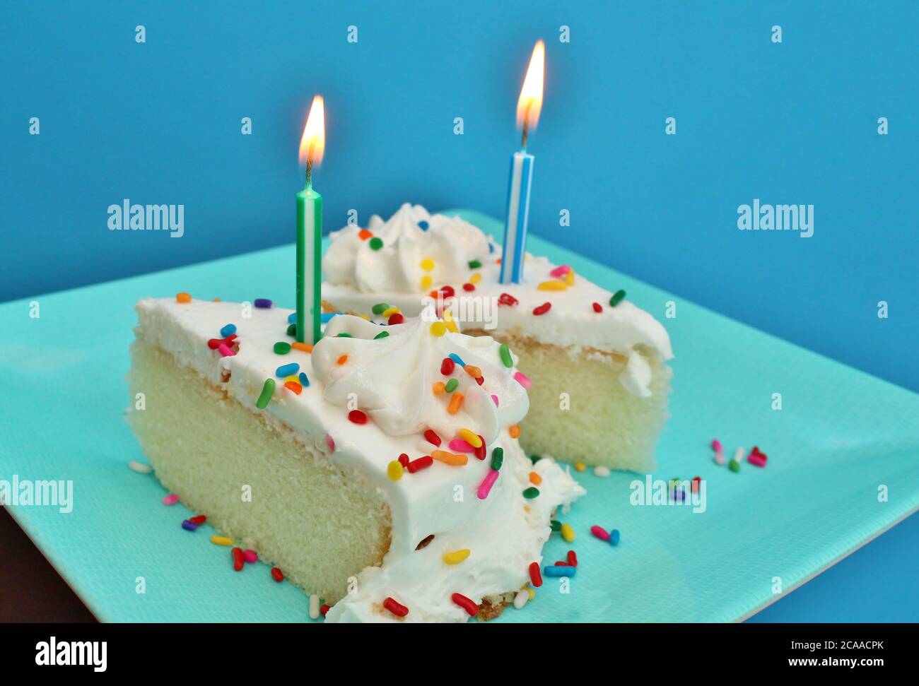 Birthday cake with lit candles Stock Photo Alamy