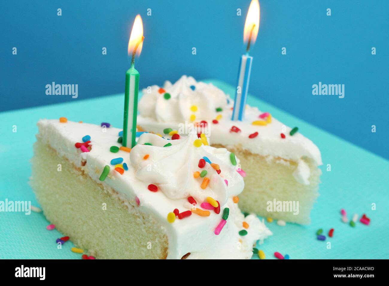 Birthday cake with lit candles Stock Photo - Alamy