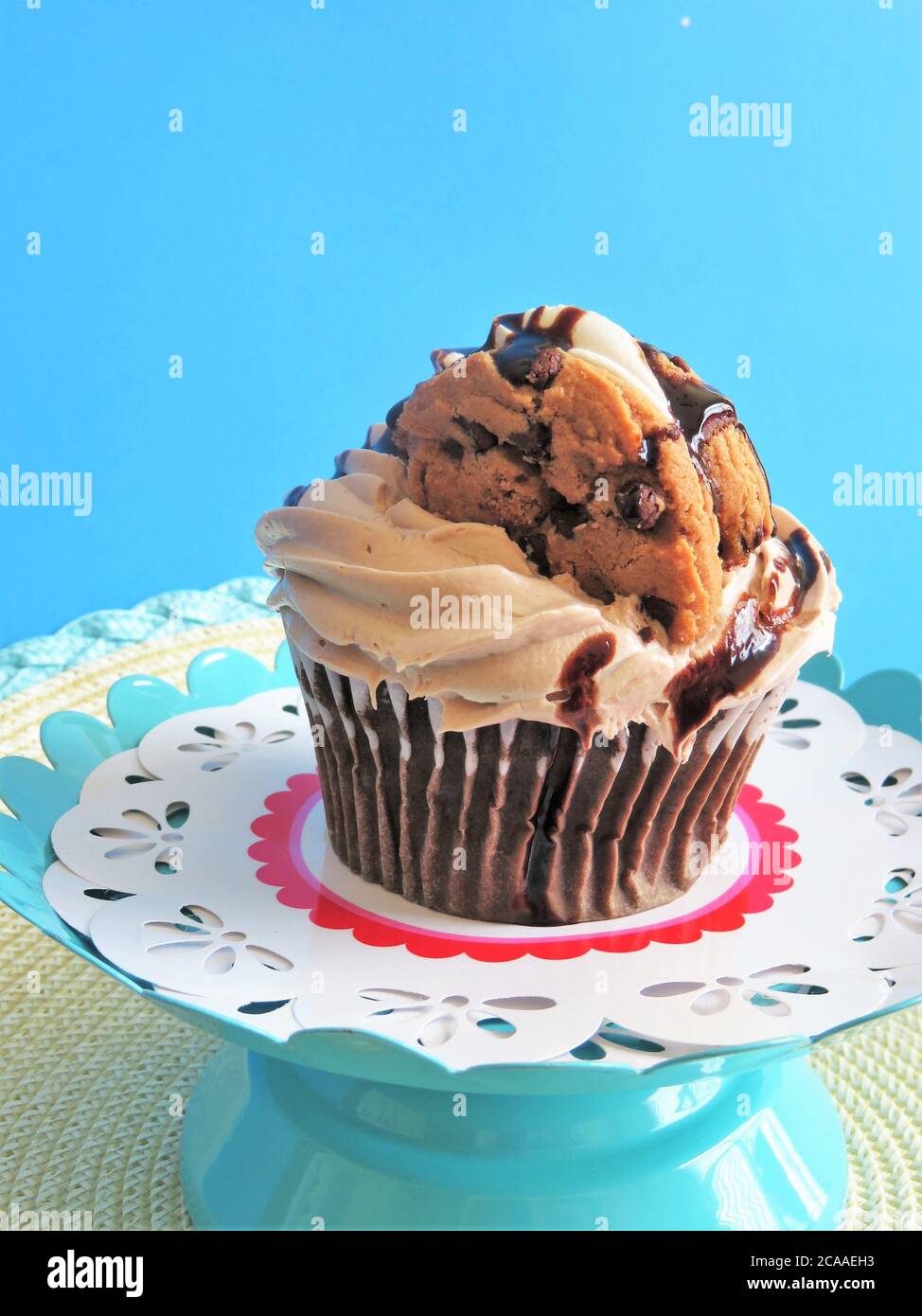 Chocolate cupcake with chocolate frosting and chocolate syrup Stock Photo