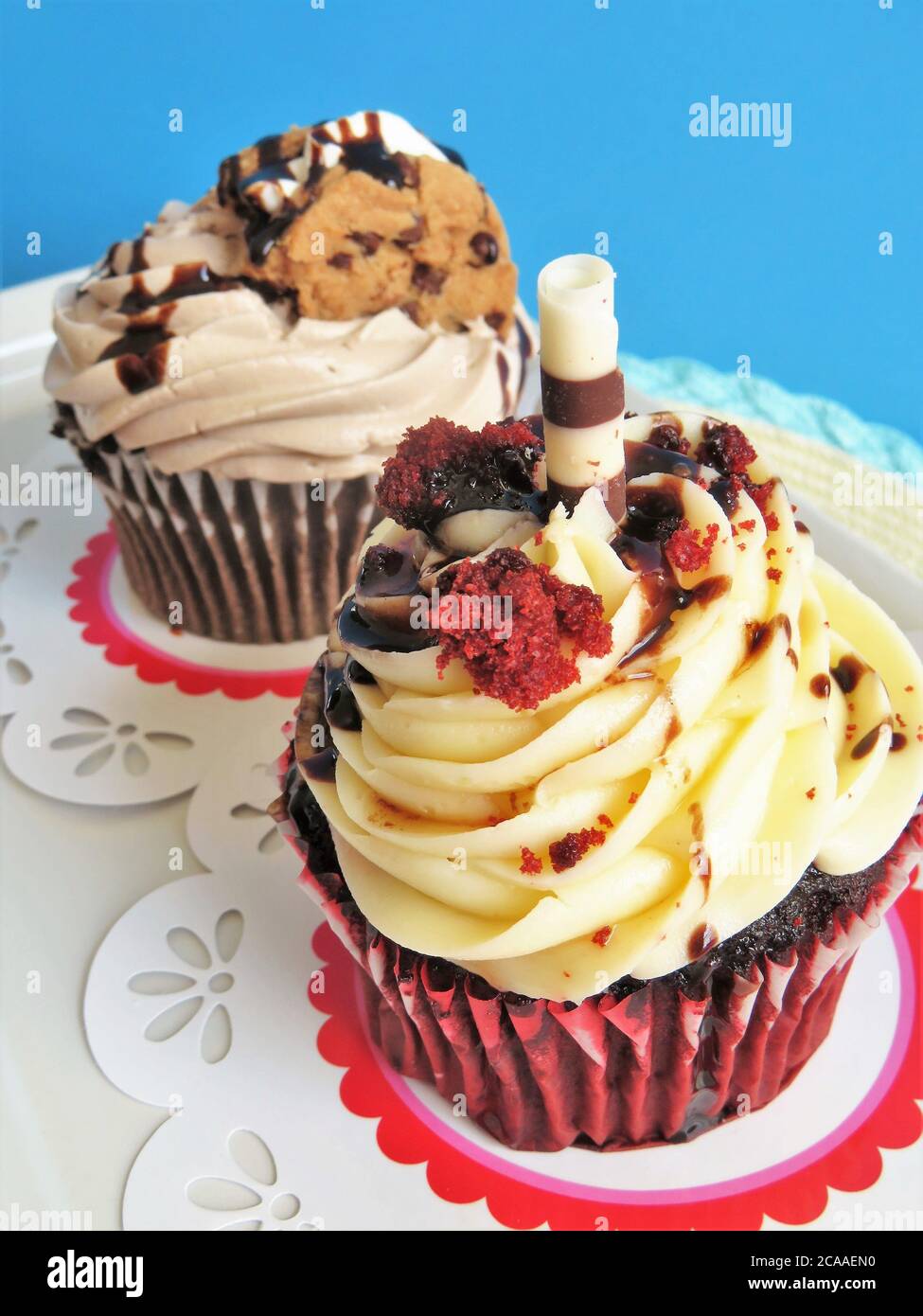 Chocolate cupcake and a red velvet cupcake with frosting Stock Photo