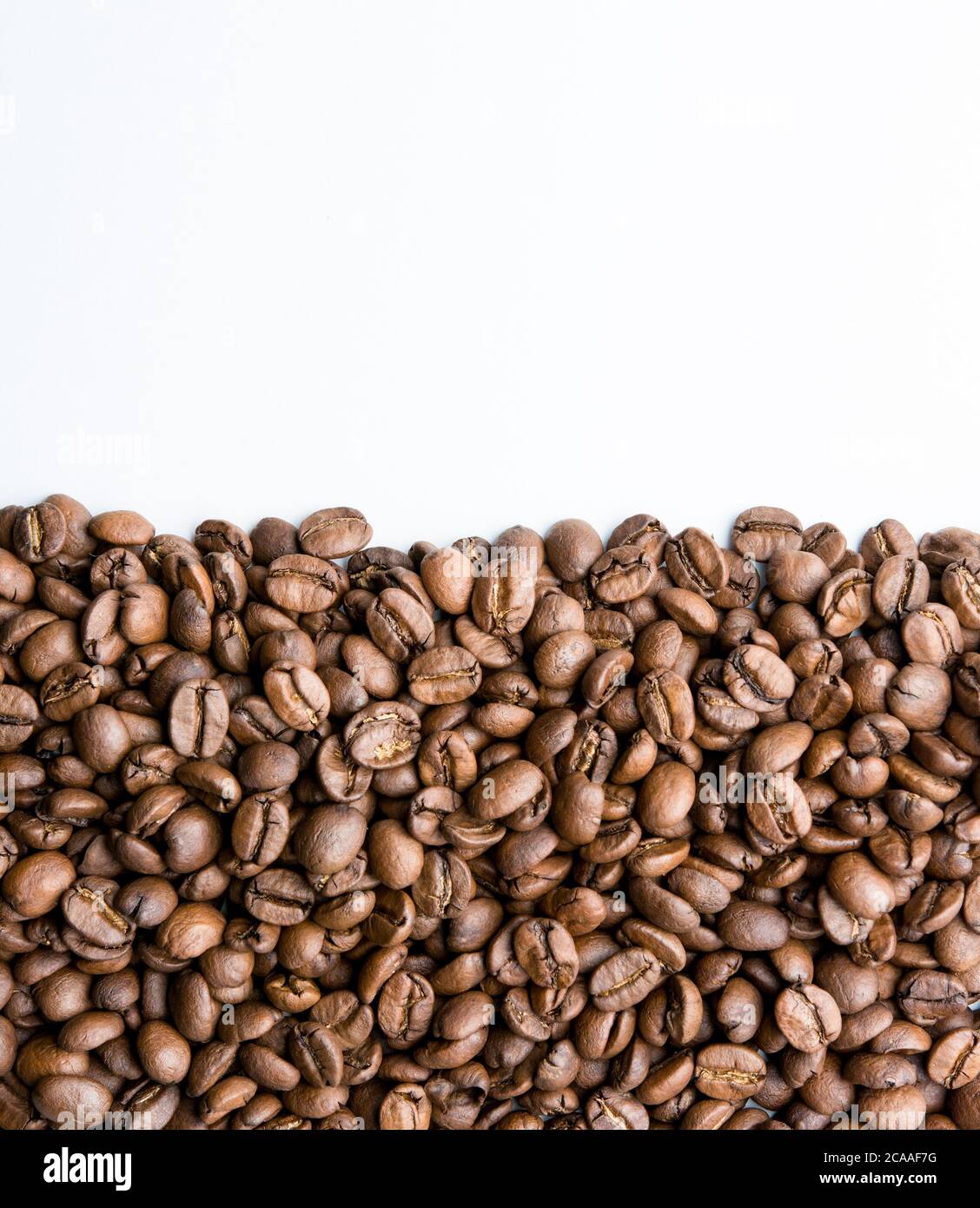 Roasted coffee beans pile isolated on white background Stock Photo - Alamy