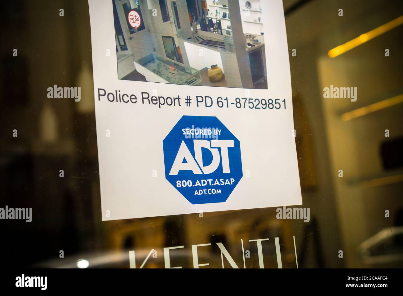 A decal informing would-be burglars that a store in Greenwich Village in New York is protected by the security firm ADT is seen on Monday, August 3, 2020. Google announced it has bought a 6.6% stake in ADT Inc., in a $450 million deal. ADT will be able to service Google’s Nest home security. (© Richard B. Levine) Stock Photo