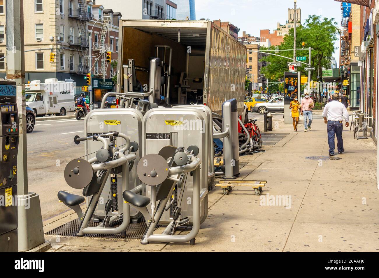 Exercise equipment is being swapped out of a closed New York Sports Club gym during the Covid-19 pandemic in New York on Monday, August 3, 2020. Gyms were originally part of the Phase 4 reopening but NYS Gov. Andrew Cuomo removed them. (© Richard B. Levine) Stock Photo