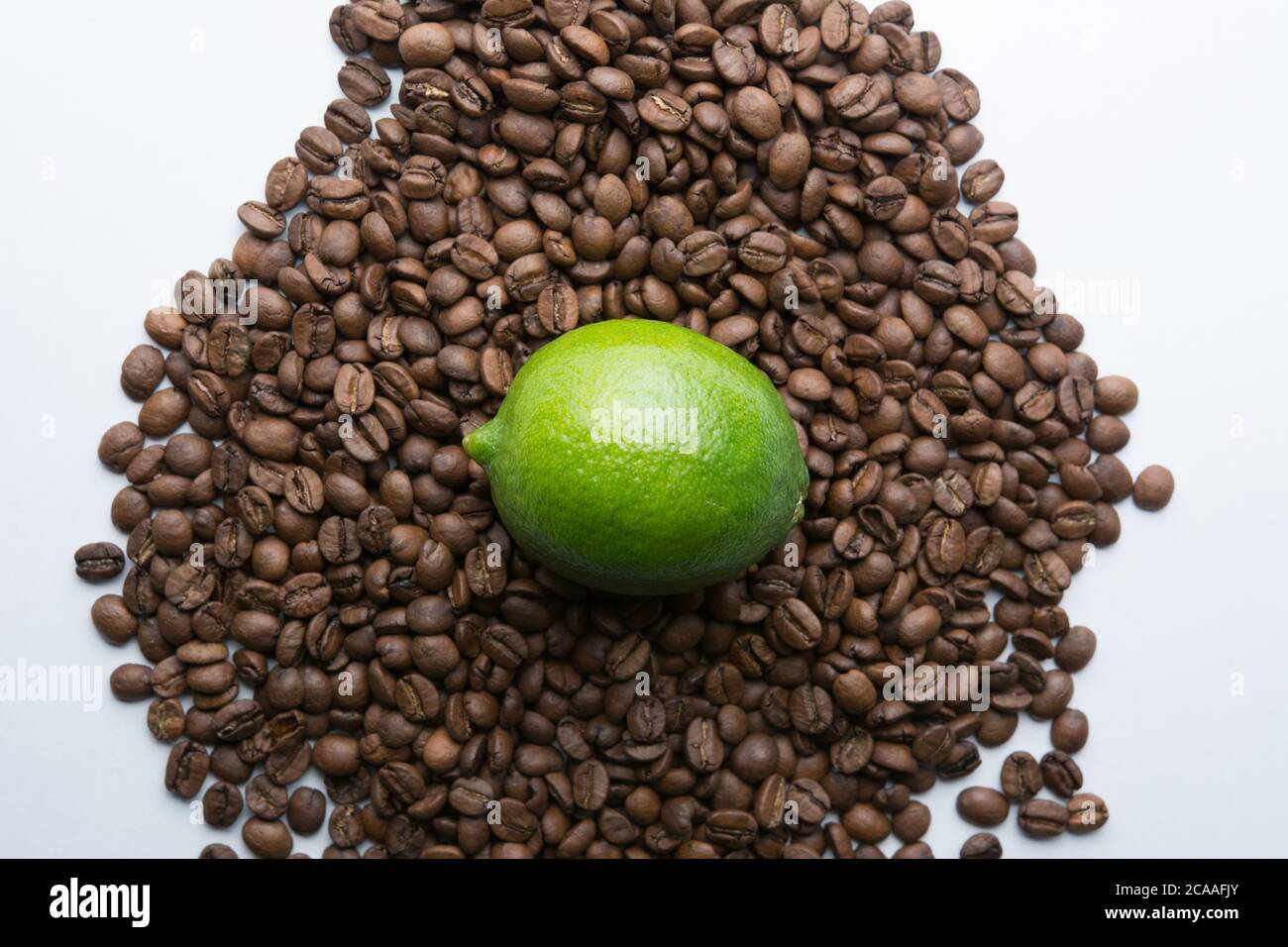 Roasted coffee beans pile isolated on white background Stock Photo - Alamy