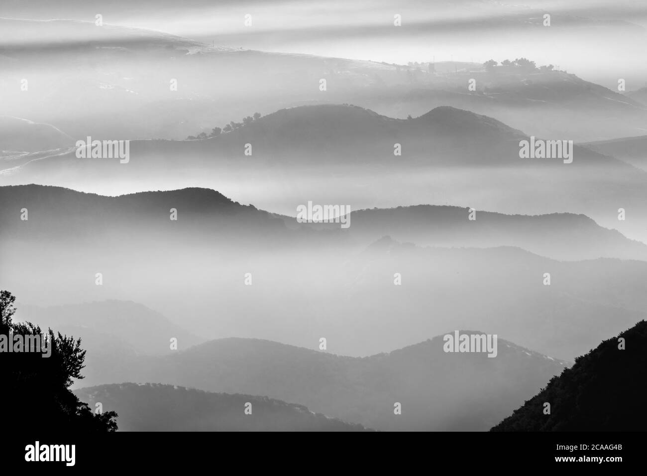 Misty mountains ridges above the canyons north of Chatsworth in Los Angeles, California. Stock Photo