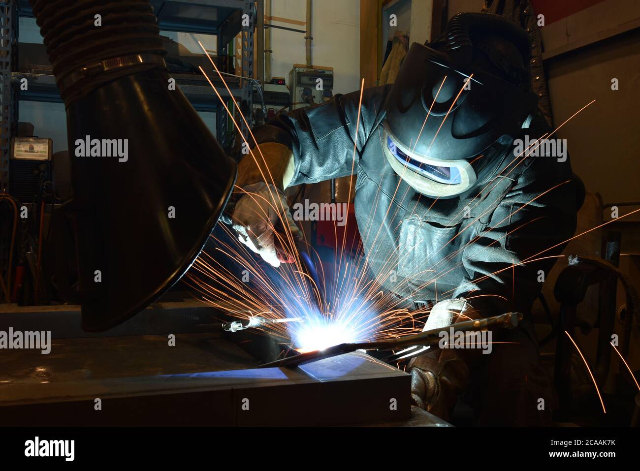 The welder is welding metal, erecting technical steel Industrial steel ...