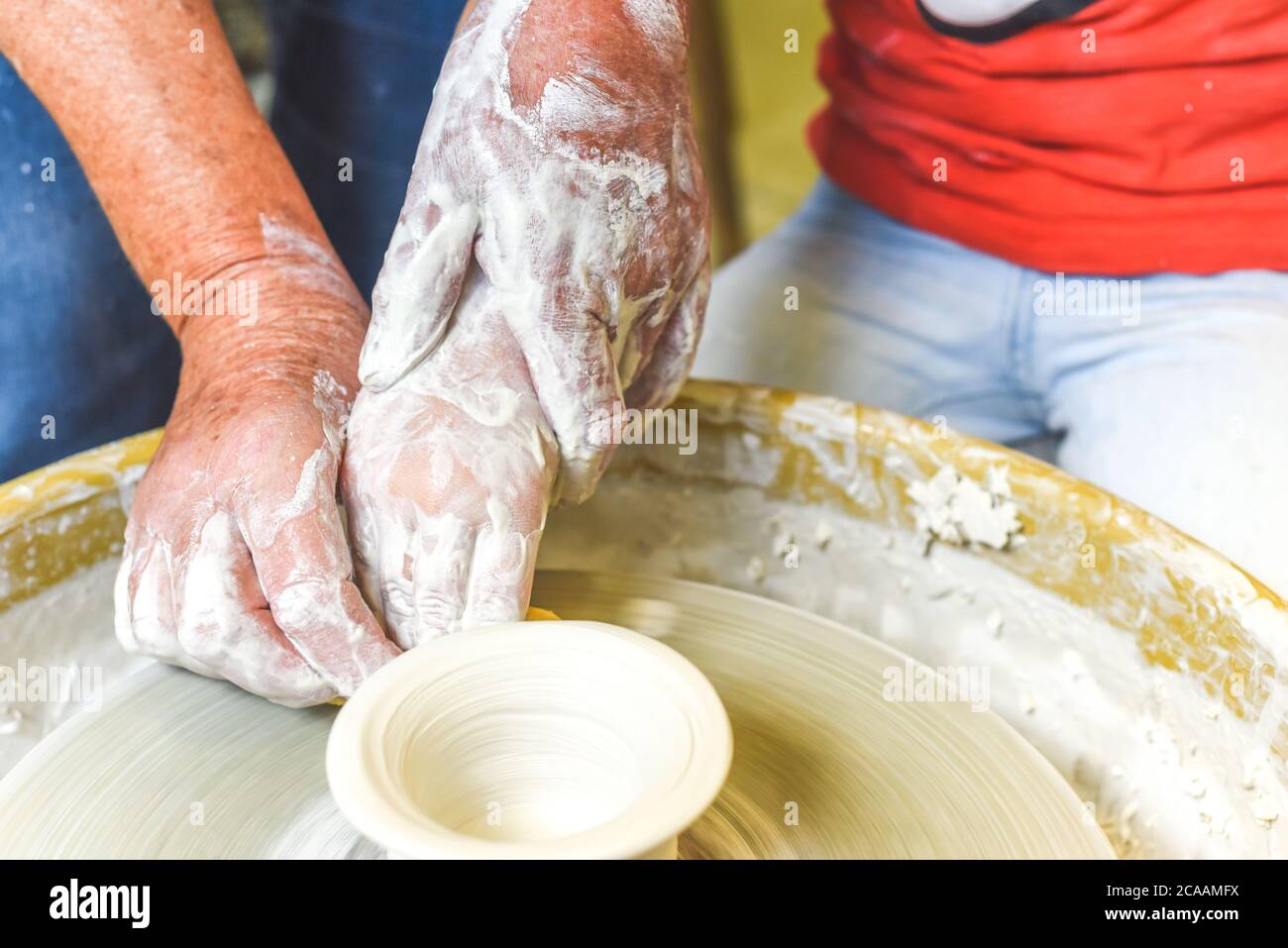 Children making pottery during ceramic lesson with clay Stock Photo Alamy