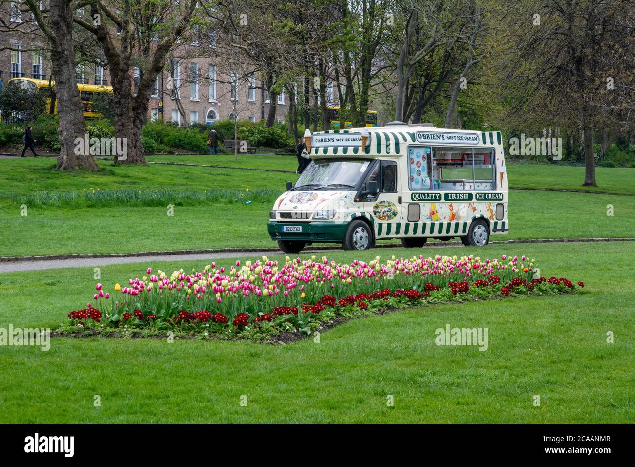 Ice cream van and tulips in the gardens at Merrion Square in Dublin Ireland Stock Photo