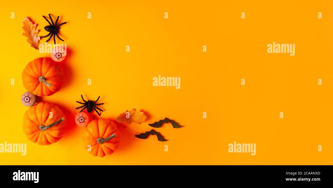Halloween scene on orange background Stock Photo - Alamy