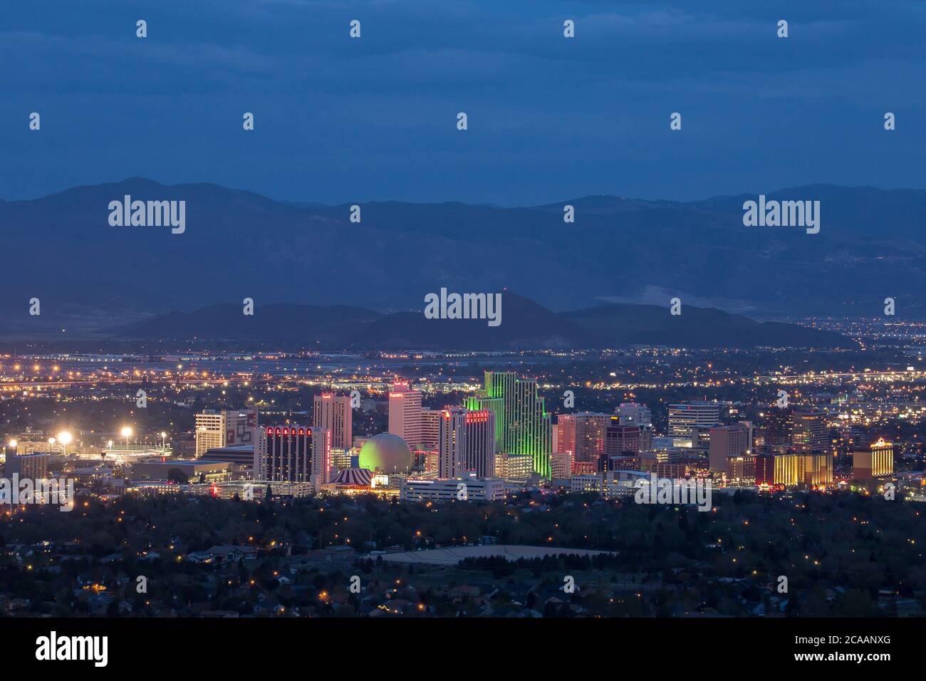 RENO, NEVADA, UNITED STATES - Apr 27, 2018: The colorful skyline of downtown Reno stretches across a background of mountains. Stock Photo