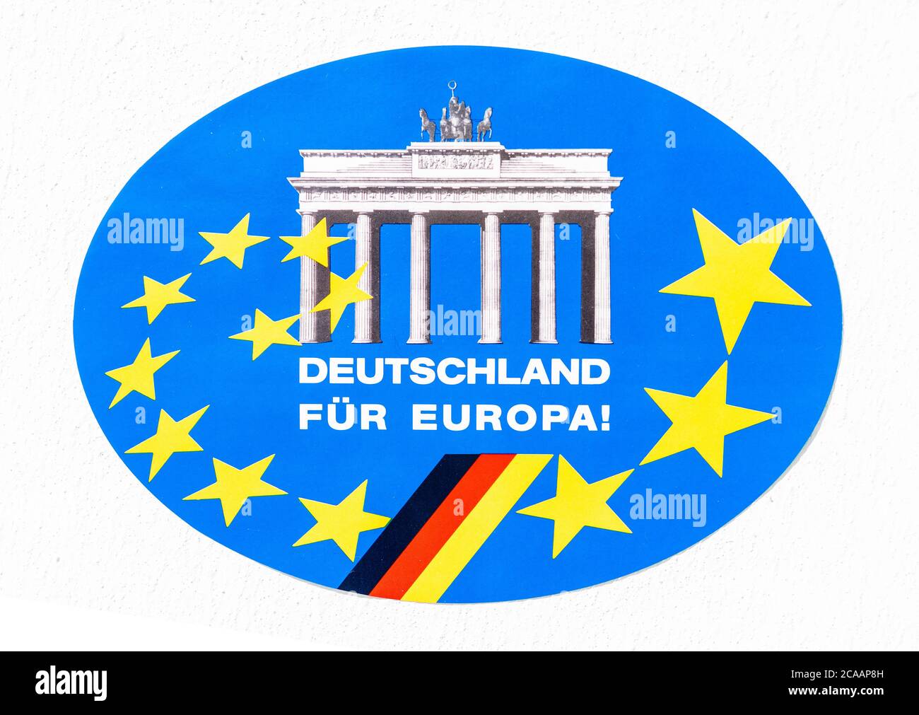 A round vintage sticker in German dating back to 1993 depicting Germany’s commitment to the founding of the European Union on November 1st 1993 – also at the time called the EU12 – the sticker displays the Brandenburg Gate, the German flag and twelve yellow stars on blue background and it reads in German ' Deutschland fuer Europa!' - Germany for Europe! Stock Photo