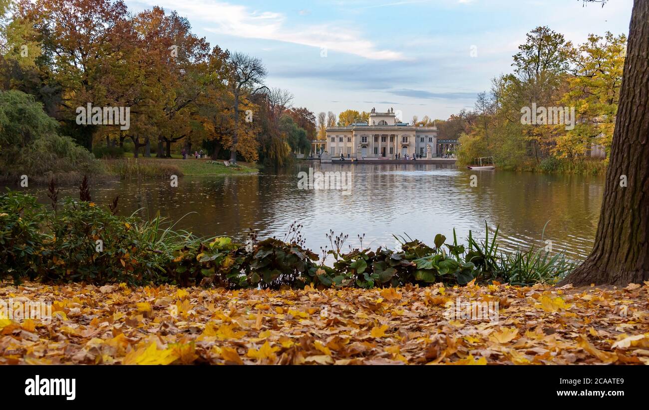 Autumn evening view of pond and palace in Royal Baths Park in Warsaw Stock Photo