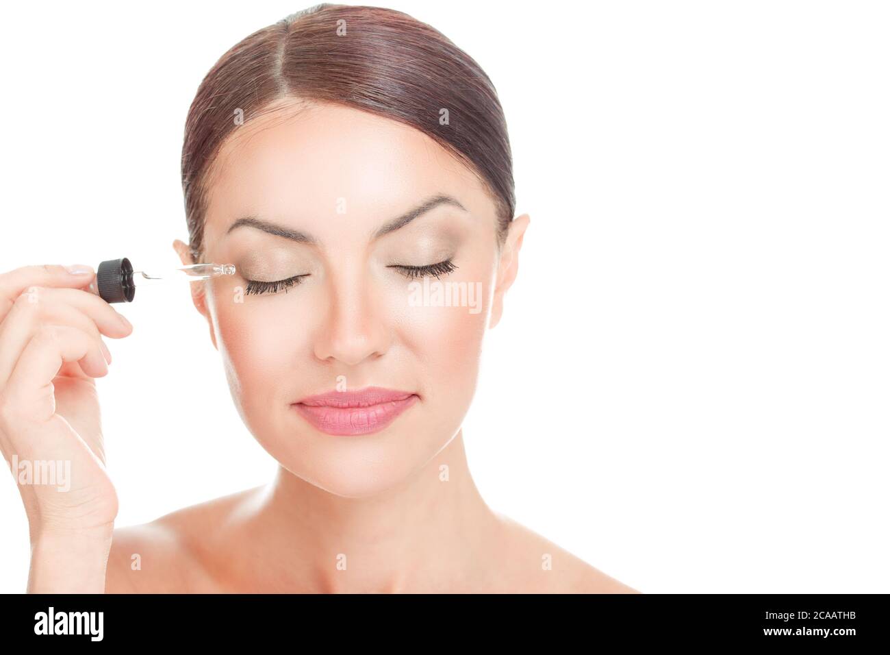 Eye Lash gel Serum. Woman applying serum essence essential oils to her