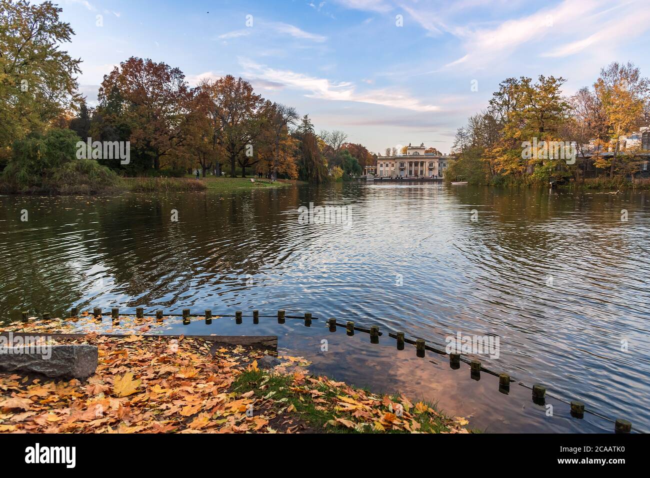Autumn evening view of pond and palace in Royal Baths Park in Warsaw Stock Photo