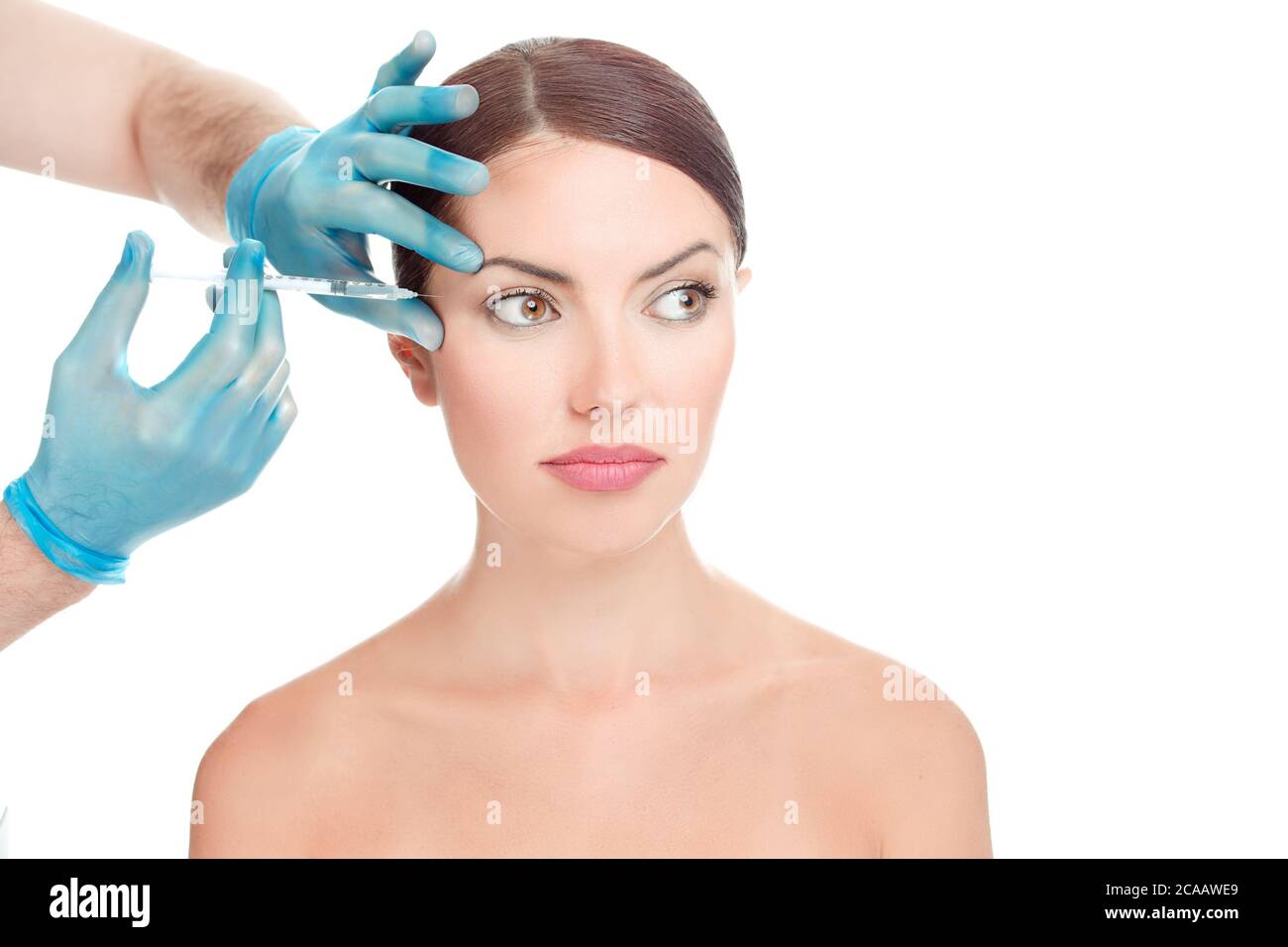 Woman having anti wrinkles, antiaging serum shot around eyes plastic