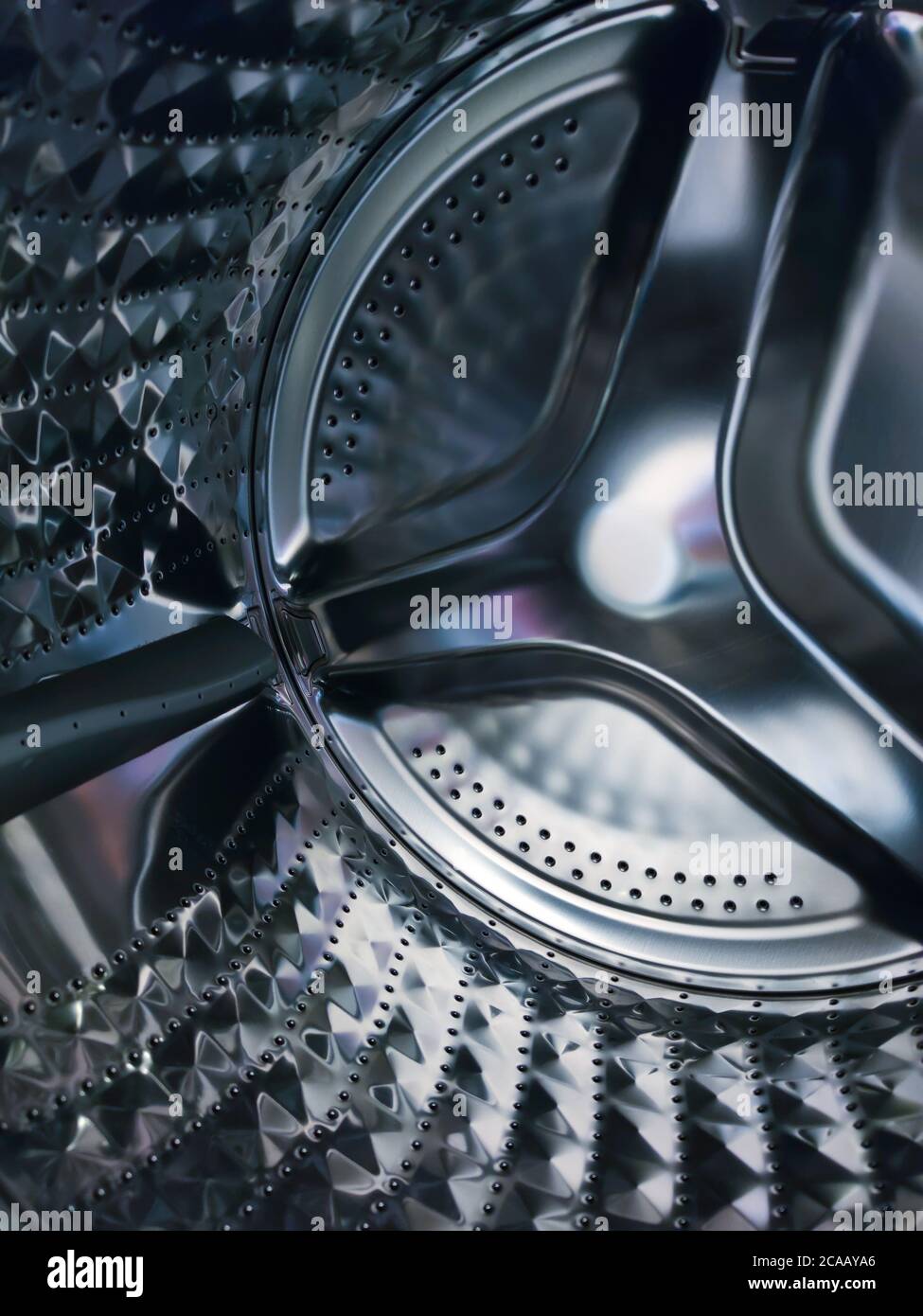 Modern washing machine with empty drum, closeup,Clean light inside the