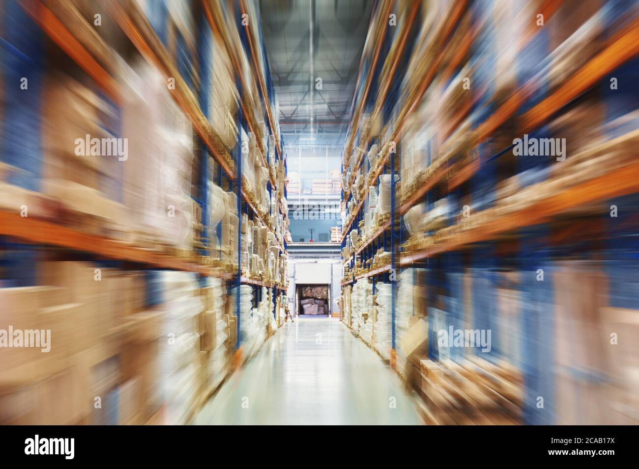 Warehouse or store factory in blurred motion effect, hardware box for delivery, logistic and distribution storage cargo. Stock Photo