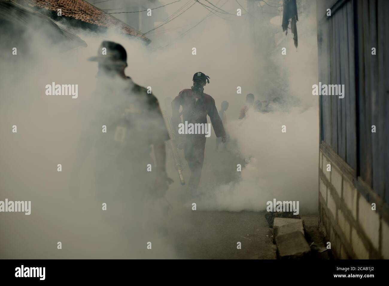 Officers from local health office conducting insecticide fogging ...