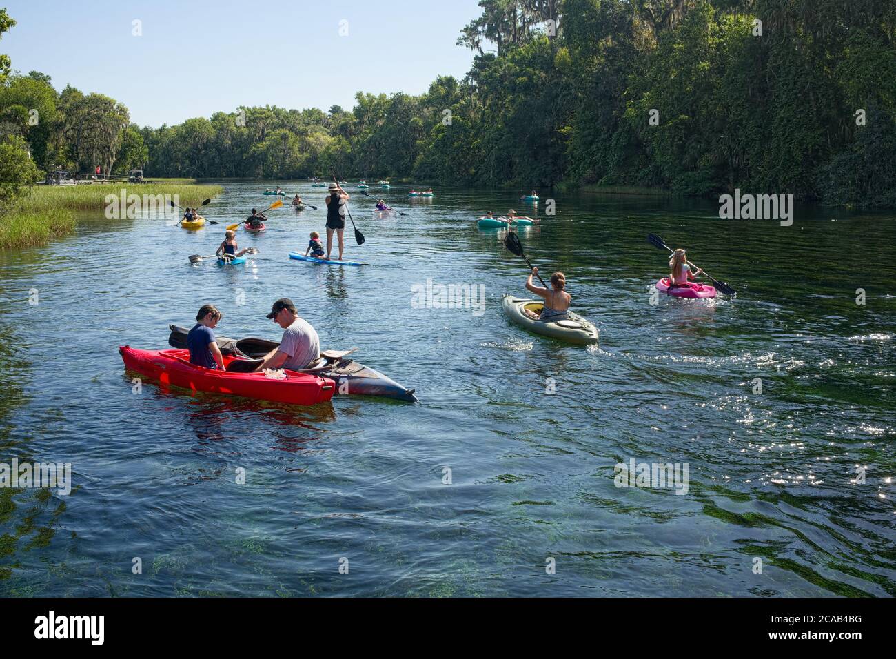 Kayaking, Tubing and Paddle Boarding on the Rainbow River. Dunnellon, Florida. in Marion County. A scenic spring fed river and popular tourist destina Stock Photo