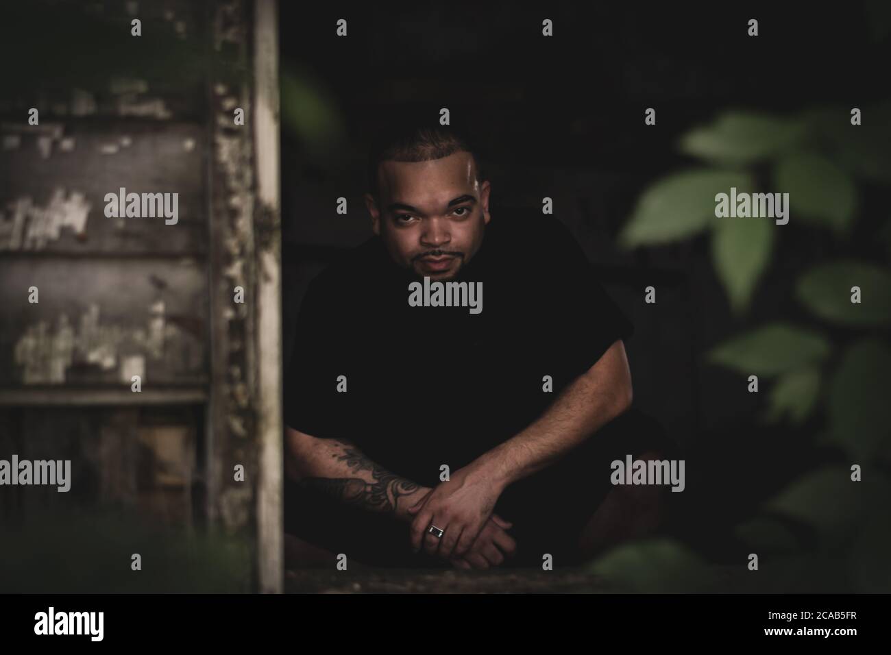 Portrait of African American/black man posing in dark abandoned house in Kentucky Stock Photo