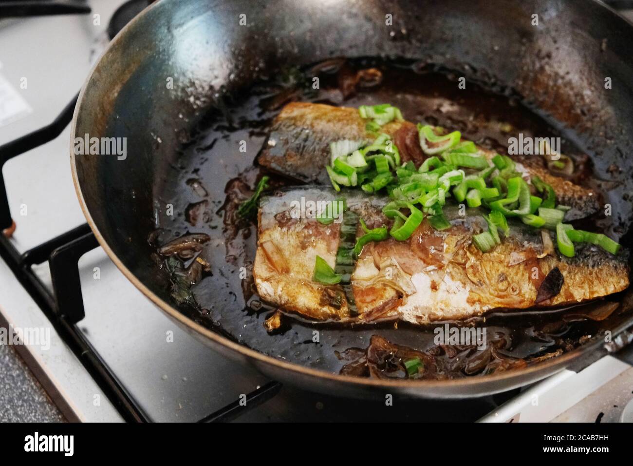 Japanese Fish fillet cooked with sweet soy sauce and spring onion