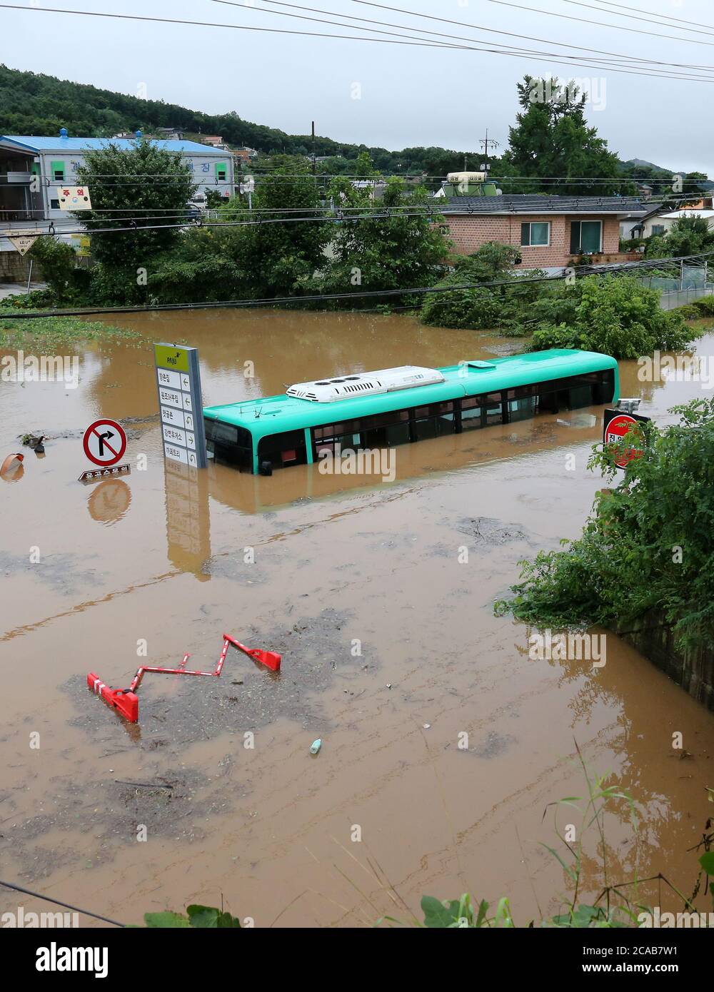 06th Aug, 2020. Submerged bus An inter-city bus is submerged by a flash ...