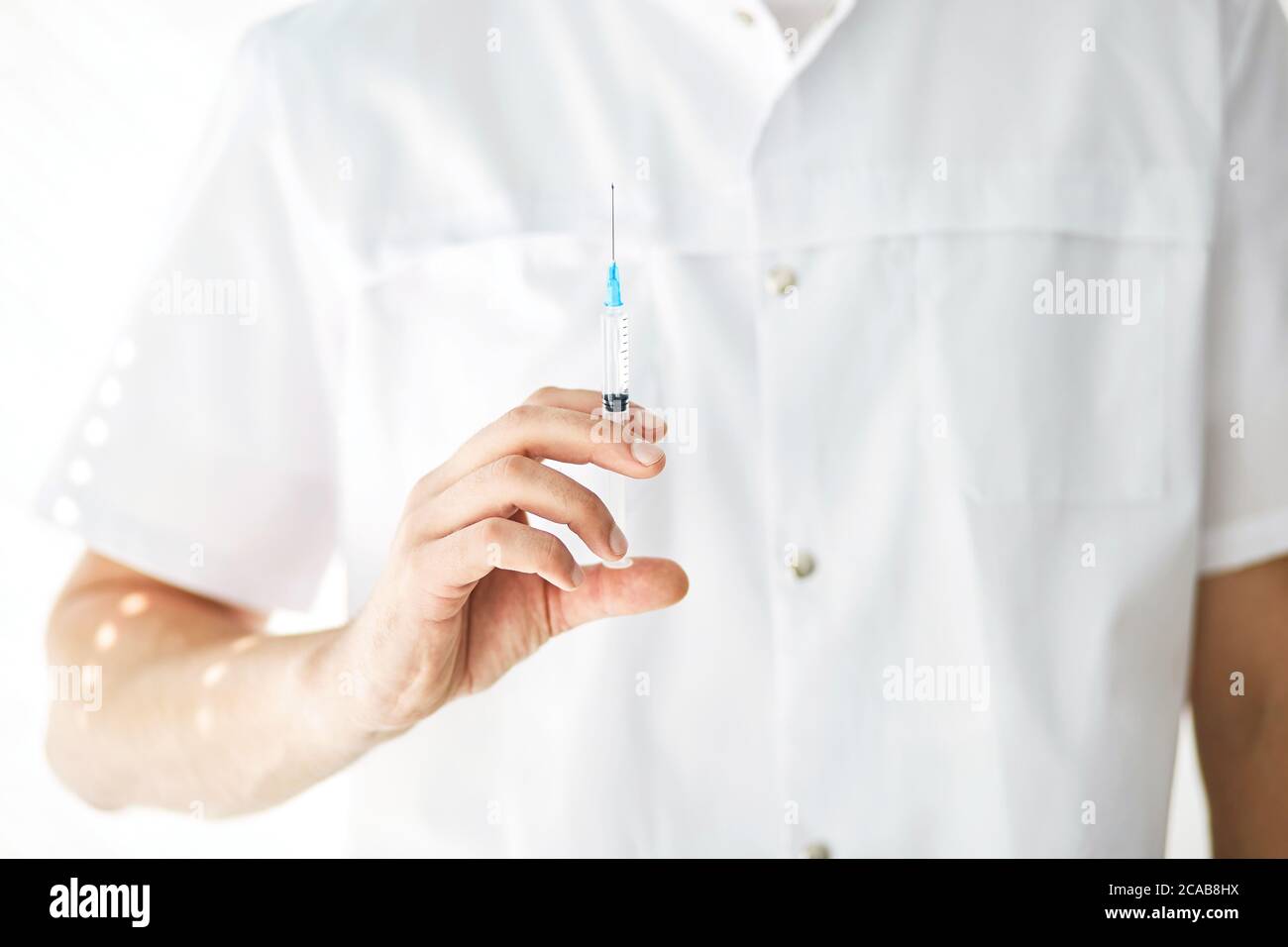 talented surgeon is going to give an injection. close up cropped photo