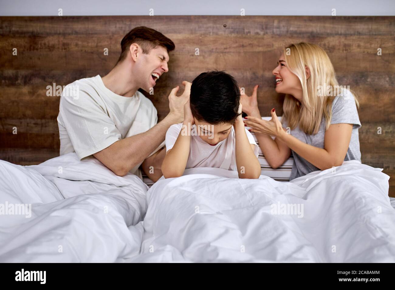 Kid parents bed angry hires stock photography and images Alamy