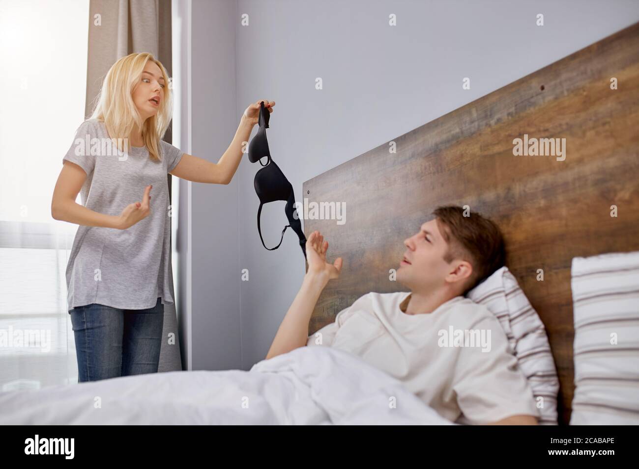 Woman man bed catch hires stock photography and images Alamy