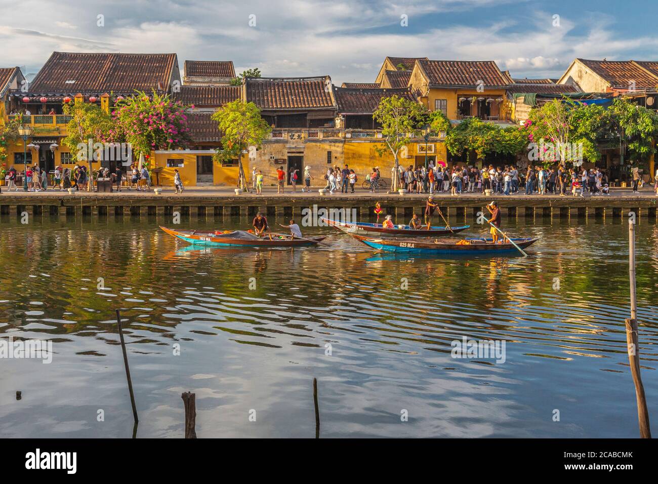 Tourist Boats Along The Thu Bon River In The Old Historical Town Of Hoi tourist-boats-along-the-thu-bon-river-in-the-old-historical-town-of-hoi