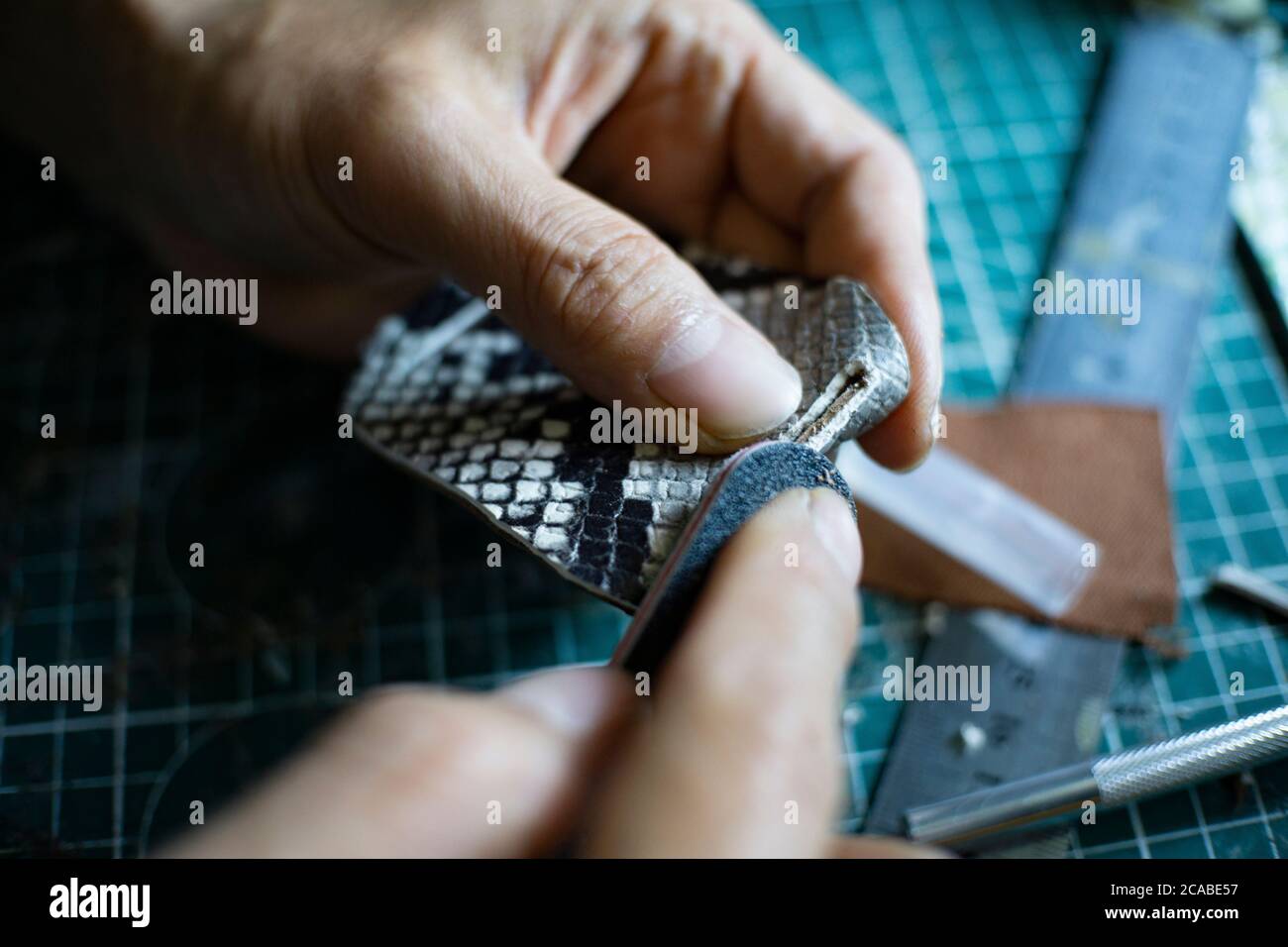 leather craftsman working Stock Photo