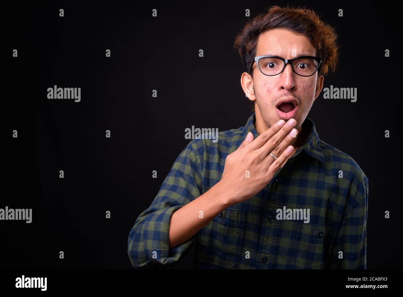 Shocked young man curly hair hi-res stock photography and images - Alamy