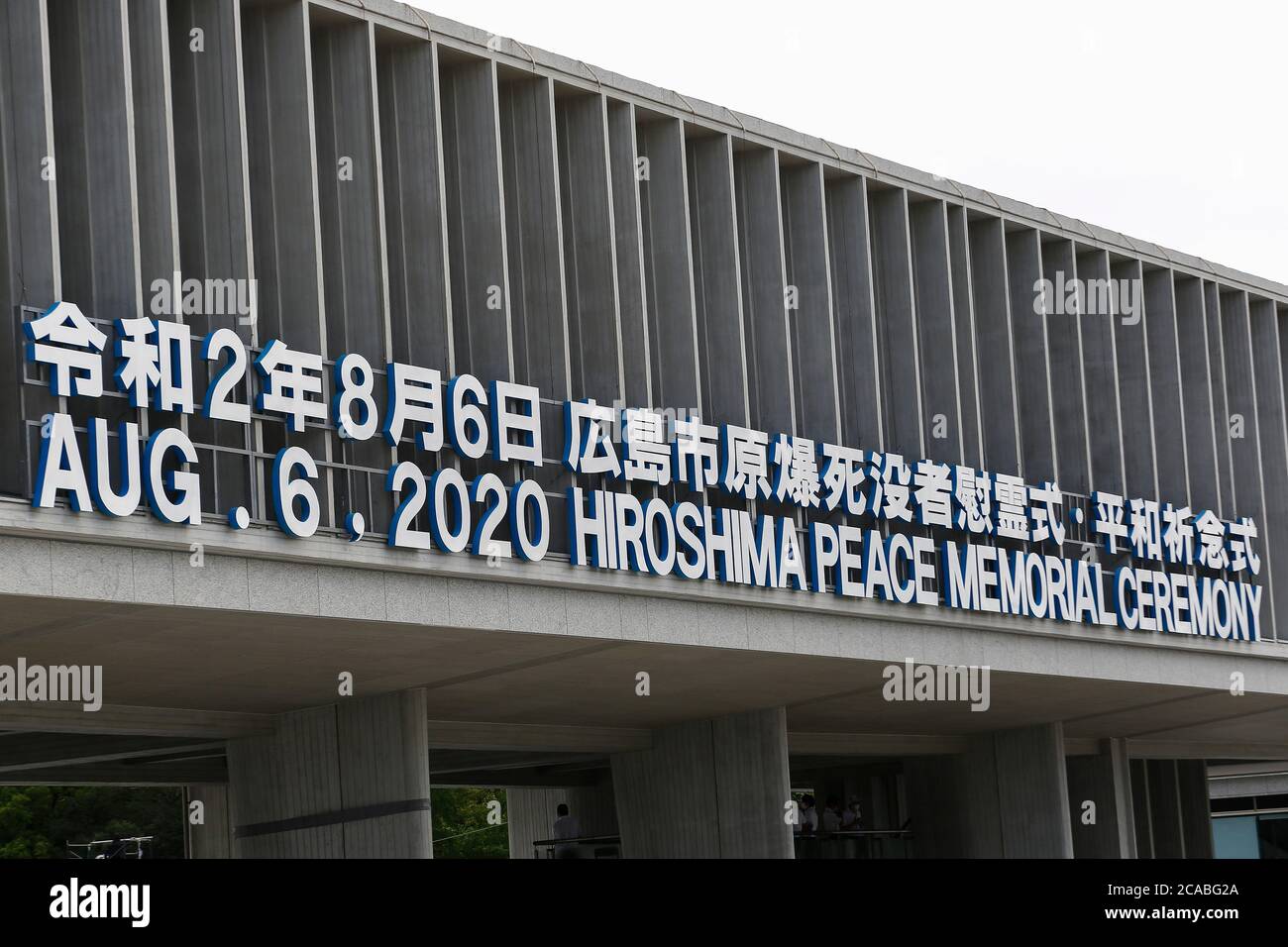 Hiroshima, Japan. 6th Aug, 2020. A signboard of the Hiroshima Peace Memorial Ceremony 2020 is on display at the entrance of the Peace Memorial Park. Local authorities implemented measures to prevent the spreading of the new coronavirus during the annual memorial ceremony at the Peace Memorial Park in Hiroshima. This year marks the 75th anniversary of the atomic bombing in Hiroshima and Nagasaki by the United States during World War II. Credit: Rodrigo Reyes Marin/ZUMA Wire/Alamy Live News Stock Photo